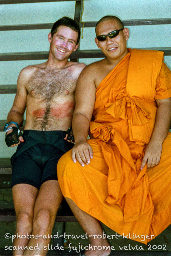 With a buddhistic monk in Thailand