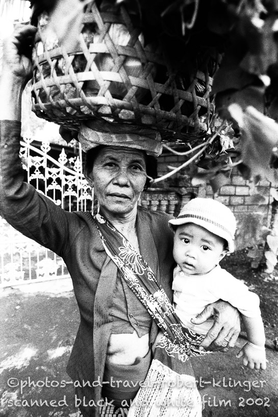 A woman on a market with her son
