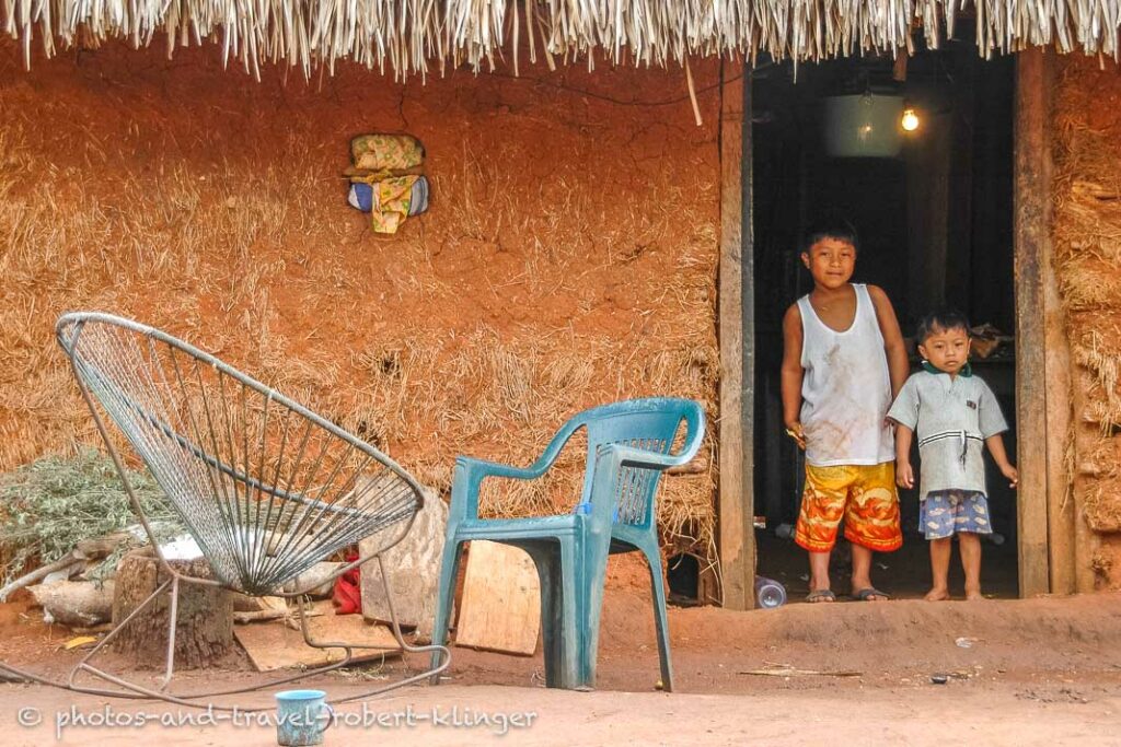 Children in Central America in front of their house