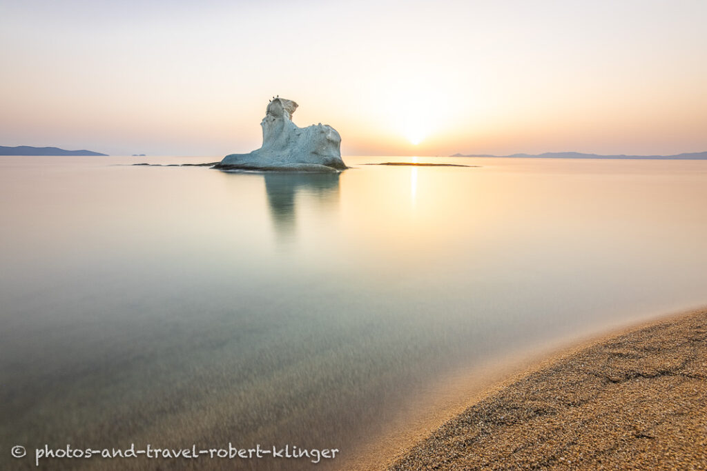 Long exposure photo of a beautiful limestone formation on a beach in Sithonia in Greece during sunrise