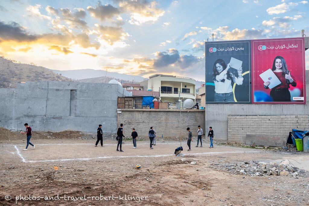 A couple of boys playing volley ball in Dukan in Iraq